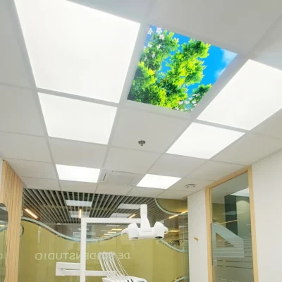 Dentled DL60 full spectrum LED panels installed in De Tandenstudio dental clinic treatment room with calming LED ceiling photo panels for patient comfort.