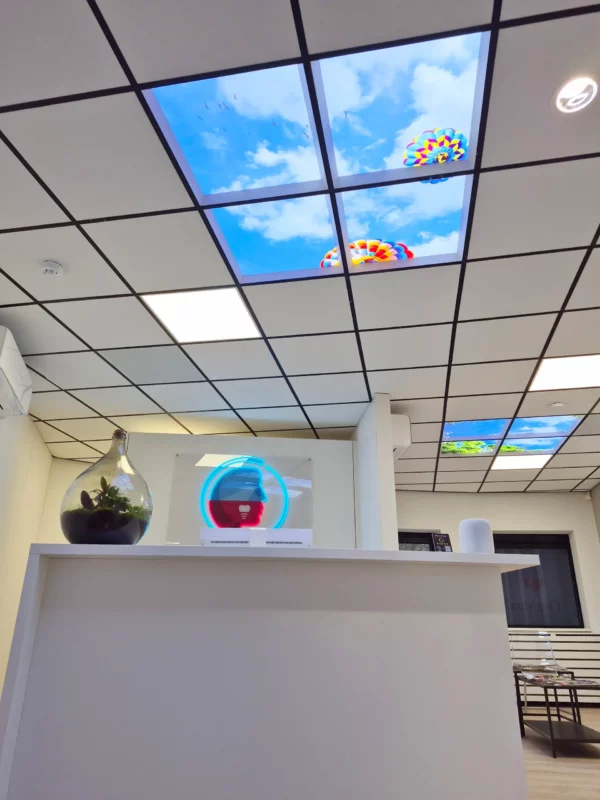 Contemporary dental clinic design with Dentled photo ceiling panels at OraMax Clinics Breda.