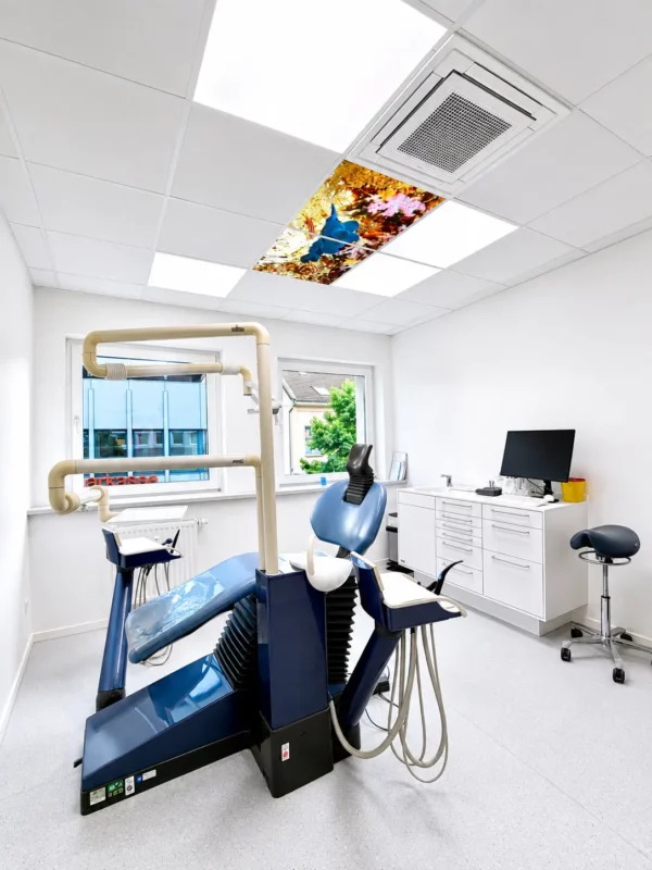 Dental distraction ceiling with illuminated photo panels at Zahnflow